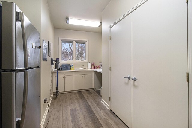 5002 Quincy Ct, Saline, MI 48176 - bathroom with wood finished floors, vanity, and baseboards