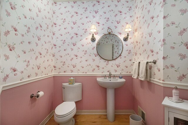 5002 Quincy Ct, Saline, MI 48176 - bathroom featuring wallpapered walls, toilet, wood finished floors, and a sink