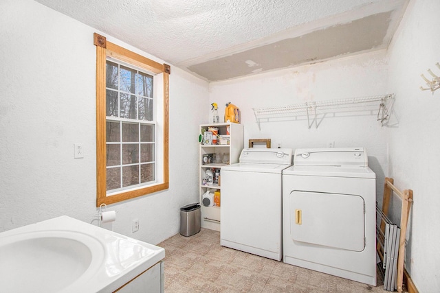 5353 Plum St, Coloma, MI 49038 - washroom with separate washer and dryer, a textured ceiling, and light flooring