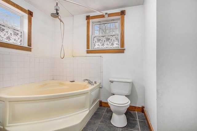 5353 Plum St, Coloma, MI 49038 - bathroom with a garden tub and tile patterned flooring