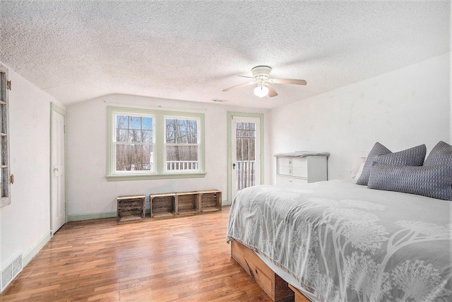 5353 Plum St, Coloma, MI 49038 - bedroom with wood finished floors, a textured ceiling, vaulted ceiling, and ceiling fan