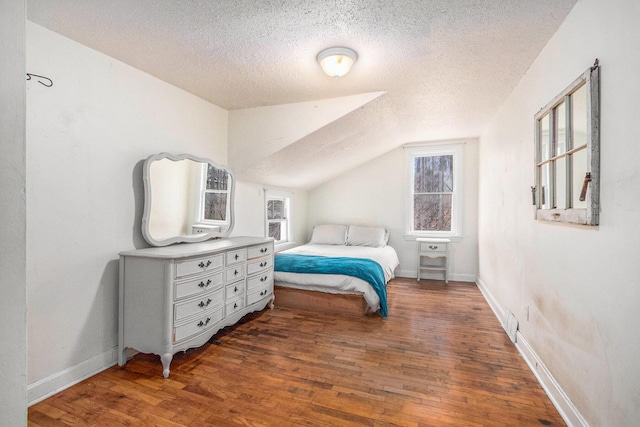 5353 Plum St, Coloma, MI 49038 - bedroom with a textured ceiling, wood finished floors, and lofted ceiling