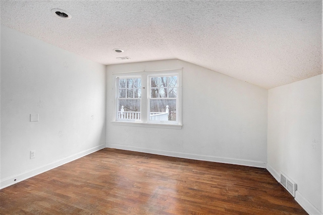 5353 Plum St, Coloma, MI 49038 - additional living space with a textured ceiling, wood finished floors, lofted ceiling, and recessed lighting
