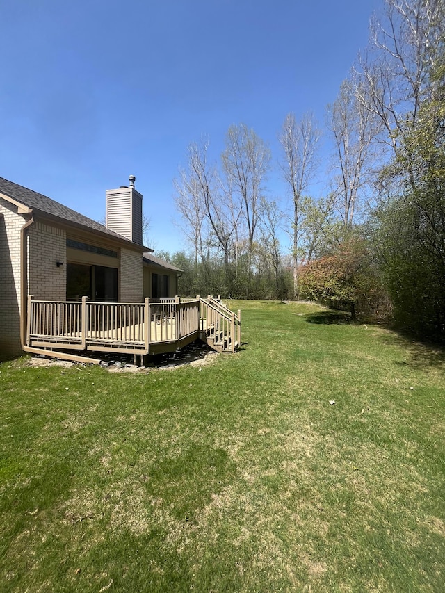 view of yard with a wooden deck