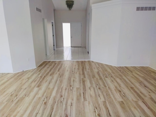 empty room with visible vents and wood finished floors