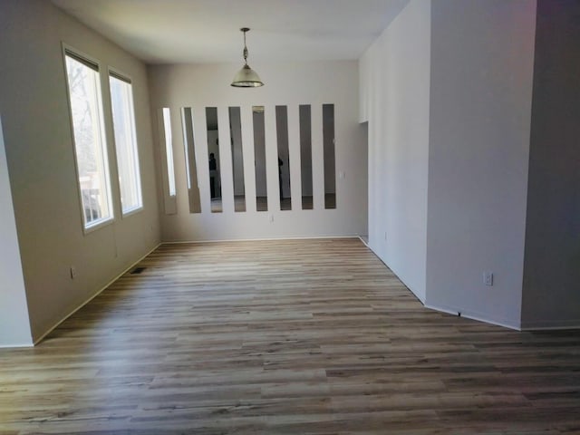 7355 Sherwood Crk, West Bloomfield, MI 48322 - unfurnished dining area with wood finished floors