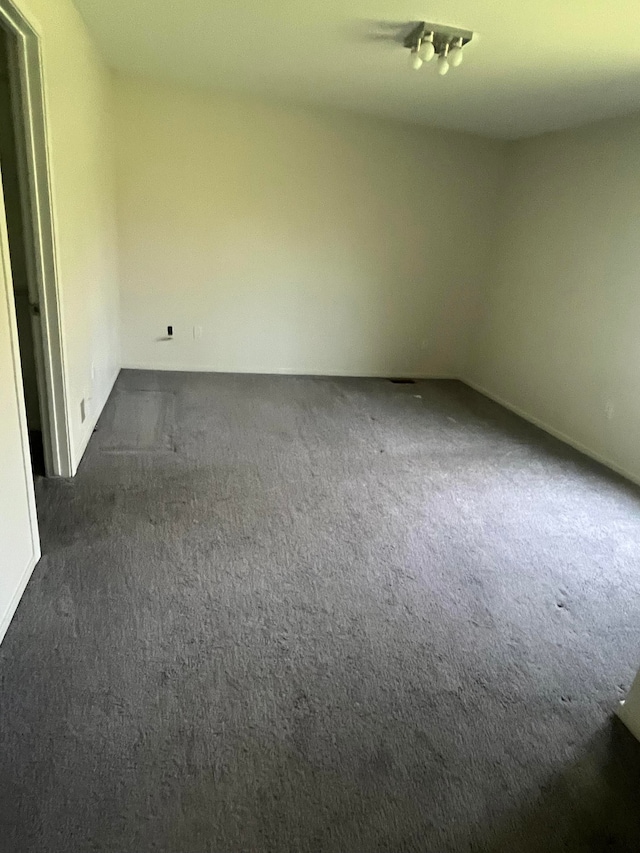 7355 Sherwood Crk, West Bloomfield, MI 48322 - empty room featuring dark carpet