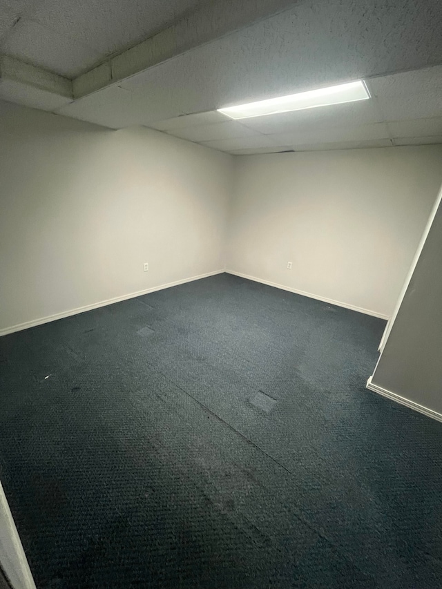 7355 Sherwood Crk, West Bloomfield, MI 48322 - empty room with baseboards and dark colored carpet