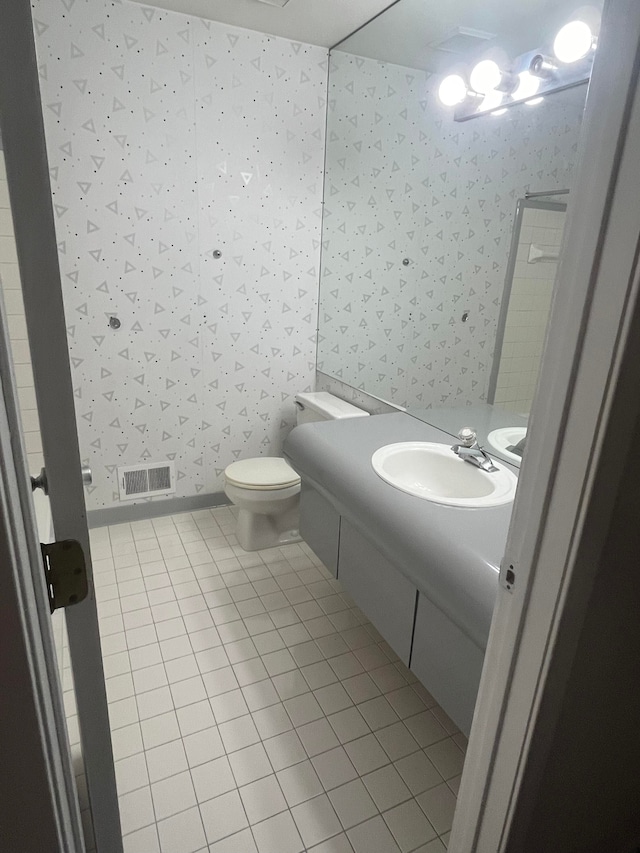 7355 Sherwood Crk, West Bloomfield, MI 48322 - bathroom with wallpapered walls, vanity, tile patterned floors, and toilet