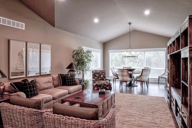 living room with visible vents, a chandelier, recessed lighting, wood finished floors, and lofted ceiling