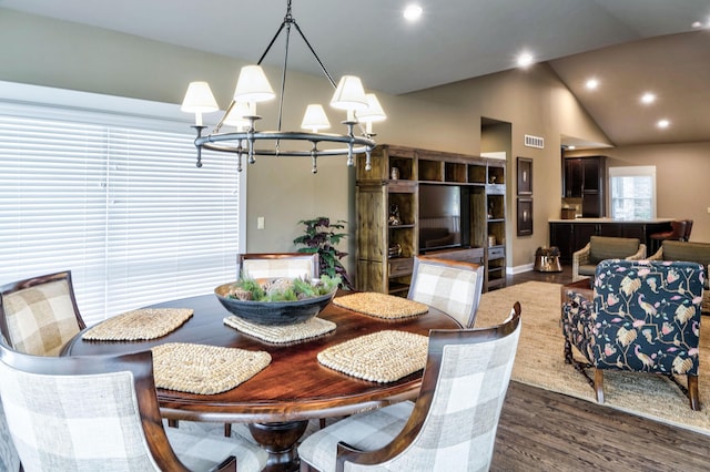 dining area featuring visible vents, a chandelier, recessed lighting, dark wood-type flooring, and high vaulted ceiling