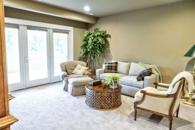 carpeted living area with recessed lighting