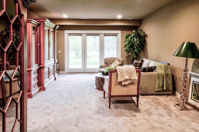 living room with baseboards, carpet, and recessed lighting