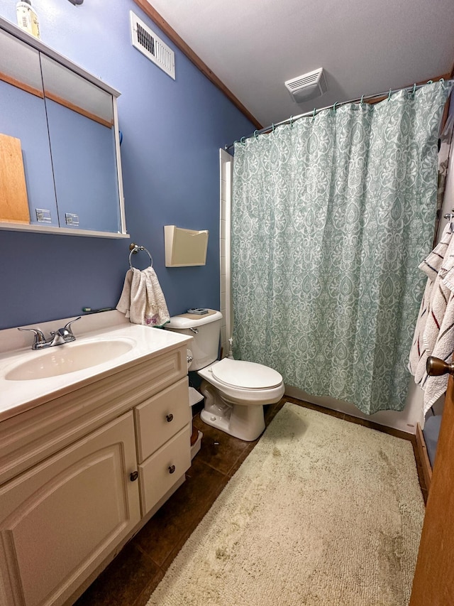 bathroom featuring toilet, vanity, tile patterned flooring, and visible vents