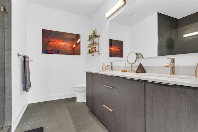229 Alfred St, Detroit, MI 48201 - full bath with toilet, a tile shower, double vanity, and baseboards