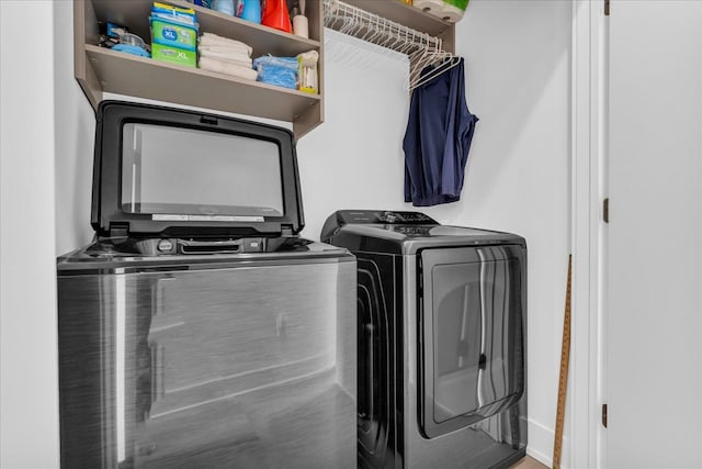 laundry room featuring washing machine and dryer