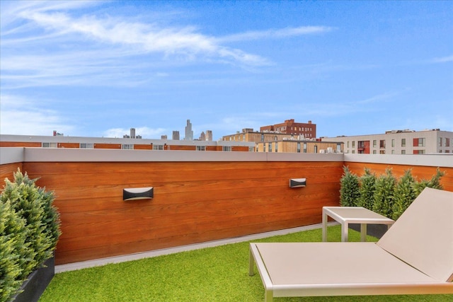 view of yard featuring a balcony