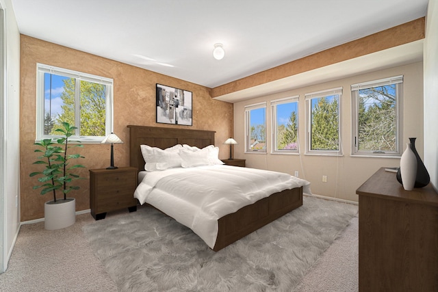 carpeted bedroom with baseboards