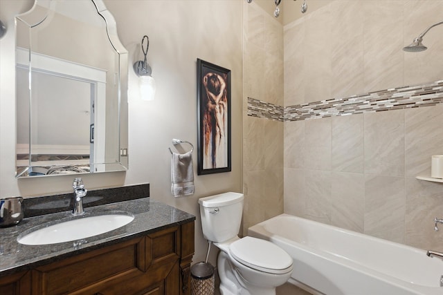 bathroom with toilet, vanity, and bathtub / shower combination