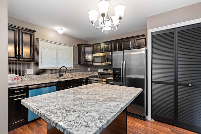 1985 Peerce, Canton, MI 48187 - kitchen with a chandelier, a sink, dark wood-style floors, and stainless steel appliances