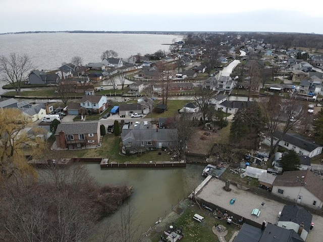 bird's eye view featuring a water view and a residential view