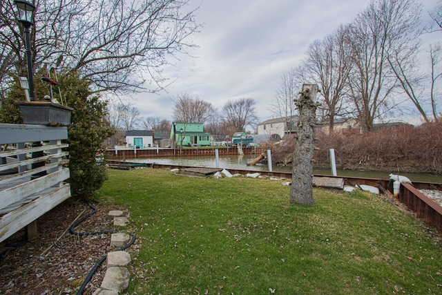 view of yard with a dock