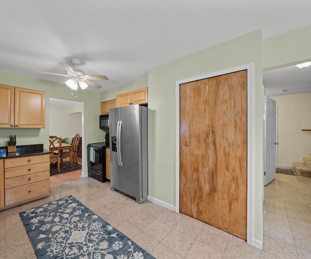kitchen featuring baseboards, light brown cabinets, dark countertops, ceiling fan, and black appliances