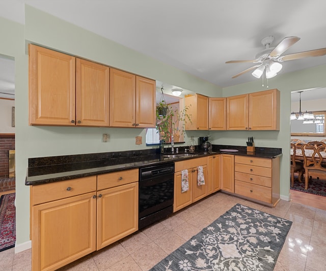 kitchen with baseboards, light brown cabinets, black dishwasher, ceiling fan with notable chandelier, and a sink