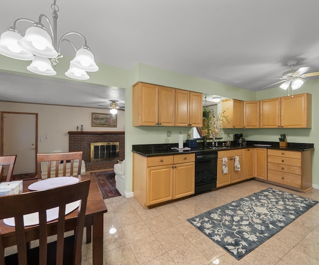 kitchen featuring baseboards, a fireplace, dark countertops, dishwasher, and ceiling fan with notable chandelier