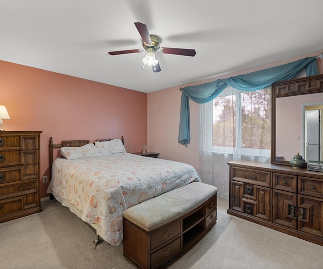 bedroom with light colored carpet and ceiling fan