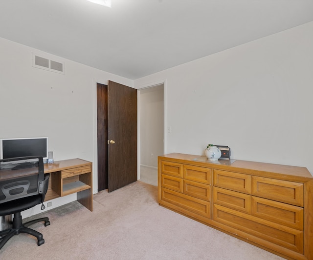 office space featuring visible vents and light colored carpet