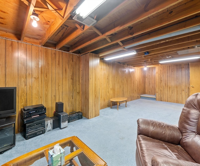living room with wood walls and carpet