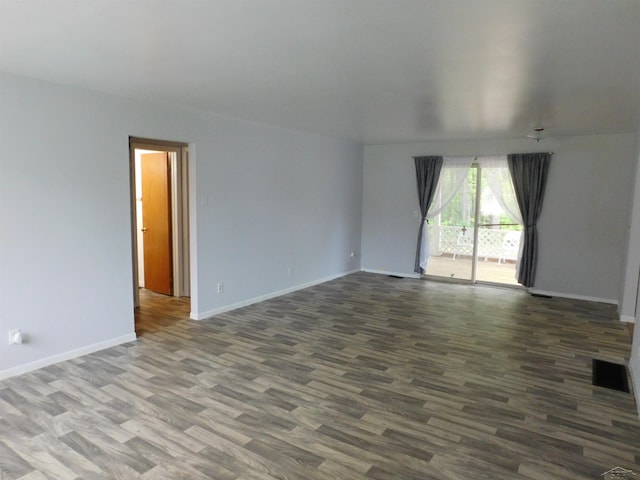 103 W Ludington Dr, Farwell, MI 48622 - spare room featuring wood finished floors and baseboards