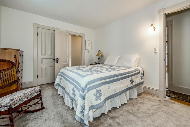 bedroom featuring baseboards and carpet floors