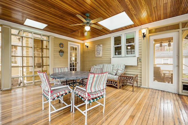 sunroom / solarium featuring a skylight