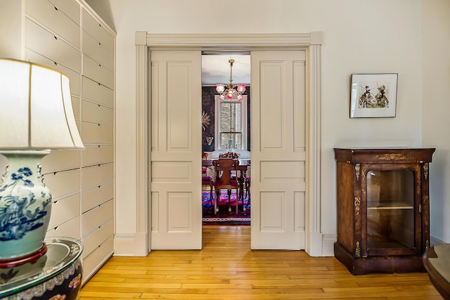 interior space with an inviting chandelier and wood finished floors