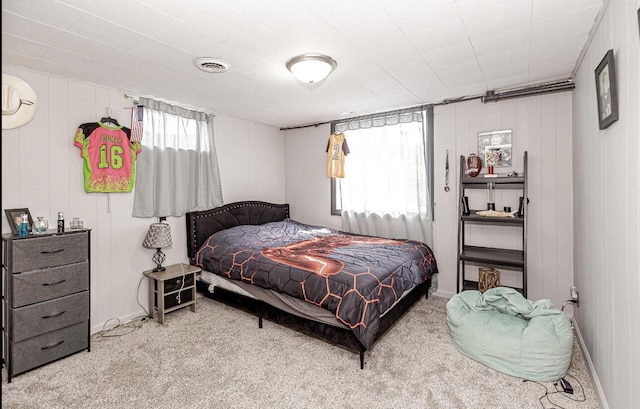bedroom featuring visible vents, baseboards, and carpet floors