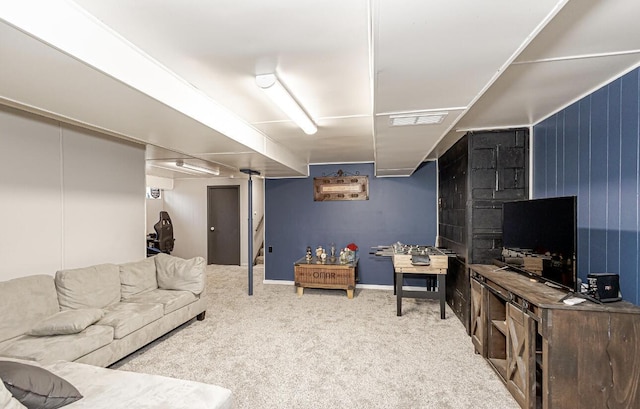 living area featuring carpet and visible vents