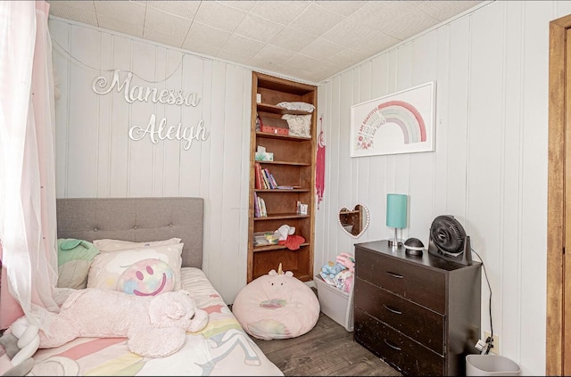 bedroom with wood finished floors