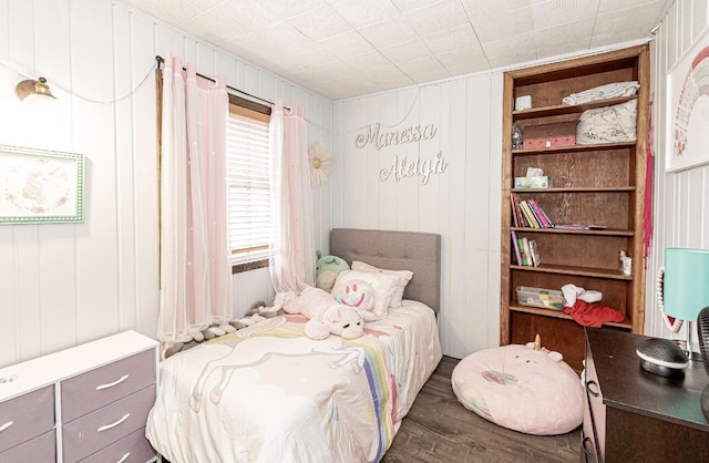 bedroom featuring wood finished floors