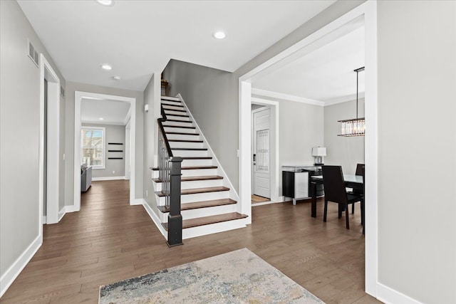 interior space featuring visible vents, recessed lighting, baseboards, and wood finished floors
