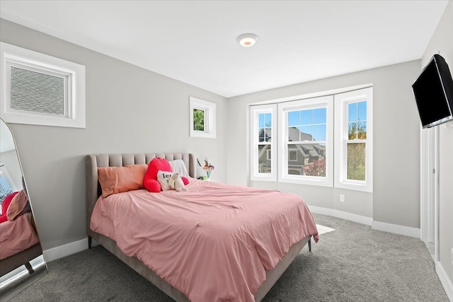 bedroom featuring carpet floors and baseboards