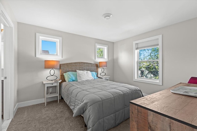 bedroom with baseboards and carpet flooring