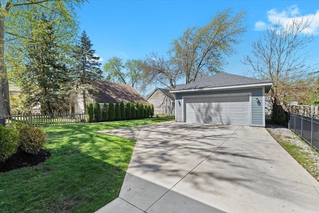 detached garage featuring fence