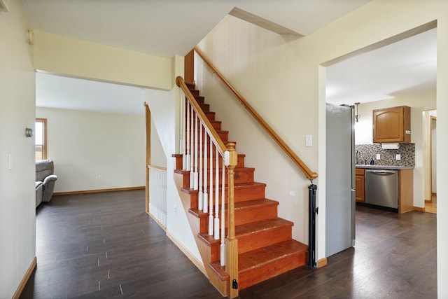 3353 Murphy Lake Rd, Millington, MI 48746 - staircase with wood finished floors and baseboards