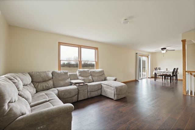3353 Murphy Lake Rd, Millington, MI 48746 - living area featuring dark wood-style flooring, ceiling fan, and baseboards