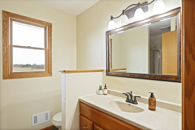 3353 Murphy Lake Rd, Millington, MI 48746 - full bath with a shower with shower door, vanity, visible vents, and toilet