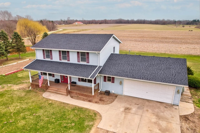 3353 Murphy Lake Rd, Millington, MI 48746 - view of front of house featuring covered porch, roof with shingles, a front lawn, an attached garage, and concrete driveway