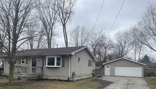 view of side of property with an outdoor structure, a deck, and a garage