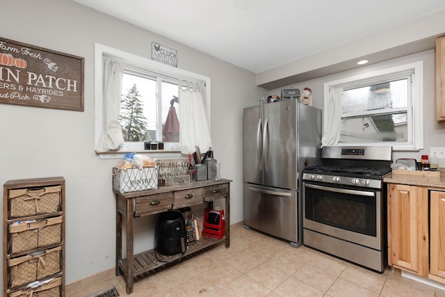 kitchen featuring light tile patterned floors, appliances with stainless steel finishes, recessed lighting, and light brown cabinets